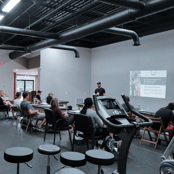 Joey Glenn teaching a course to clinicians in a performance lab